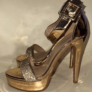 Delicacy is a 8 1/2 rose gold high heels with muti- color rhinestones